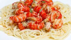 pasta with shrimp and tomato sauce on white plate