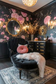 a black chair sitting on top of a rug in front of a dresser and mirror