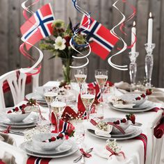 the table is set with red, white and blue decorations