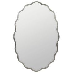 an oval shaped mirror with silver trimmings on the edges and a white background