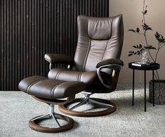 an office chair and ottoman in a room