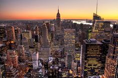 new york city skyline at sunset from the top of the empire building in midtown, new york