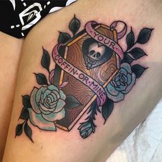 a woman's thigh with a skull and rose tattoo on it, which reads tour california