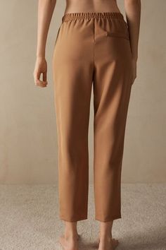 Full-length trousers featuring two pockets, faux back pocket and covered elasticated waist. Business Casual Straight Dress Pants With Pull-on Style, Brown Tapered Leg Pants With Side Pockets, Elastane Pants With Elastic Waistband And Straight Hem, Straight Hem Pants With Elastic Waistband, Brown Trousers With Side Pockets, Elegant Tapered Leg Pull-on Pants, Business Casual Elastane Pants With Pockets, Brown Workwear Pants With Pockets, Brown Work Pants With Pockets