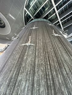 a large carpet with birds flying around it