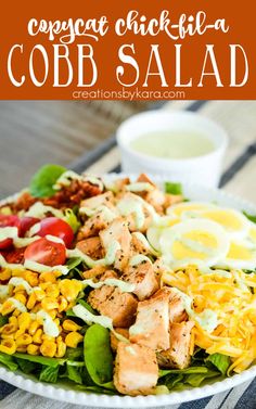 this cobb salad is loaded with chicken, lettuce, corn, tomatoes and dressing