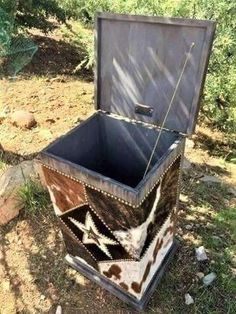 an old trunk is sitting in the grass