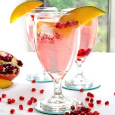 pomegranate garnishes in wine glasses with fruit on the side