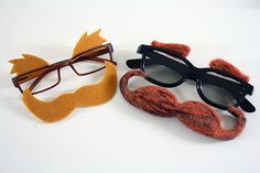 two pairs of eyeglasses made to look like mustaches and catseye glasses