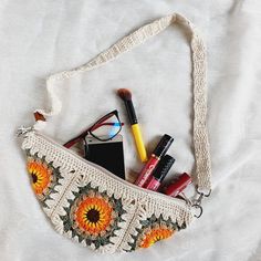 a purse with makeup and eyeglasses in it