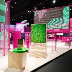 an exhibit area with pink and green walls