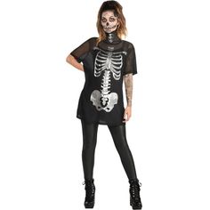 a woman wearing a skeleton shirt and leggings with her hands on her hips