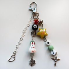 a key chain with charms attached to it