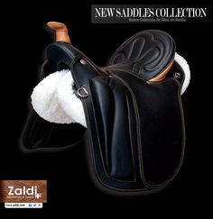 a black leather saddle with white fur on the inside and outside, in front of a black background