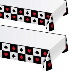 the table cloth has hearts and spades on it