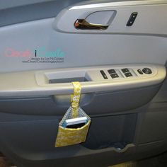 the door handle on an airplane with a yellow bag hanging from it