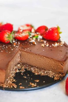 a piece of chocolate cake with strawberries on top