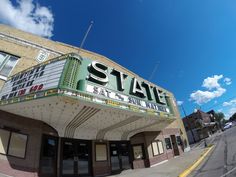 an old movie theater with the name state on it