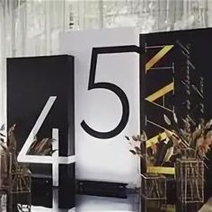 the number five is displayed in front of an artistic display