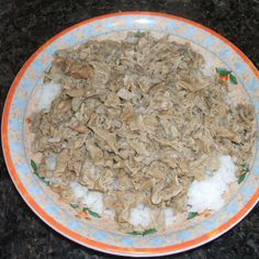 a bowl filled with oatmeal sitting on top of a black countertop