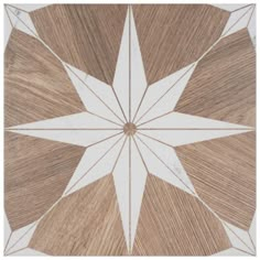 a white and brown tile design on the floor in an area that looks like it is made out of wood