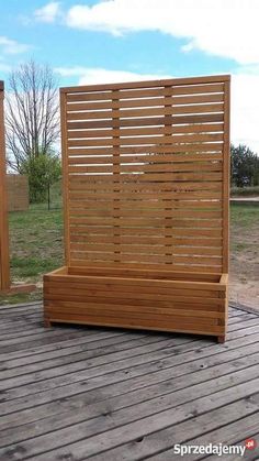 a wooden bench sitting on top of a wooden deck