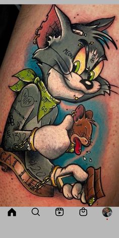 an image of a cartoon character on the back of a man's leg with tattoos