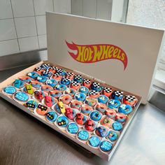 a box filled with cupcakes sitting on top of a counter