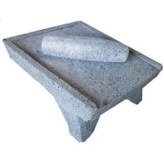 a stone table with two large rocks on it