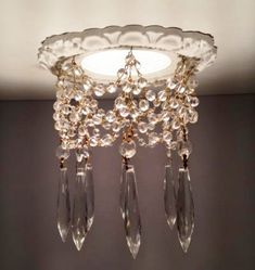 a chandelier hanging from the ceiling in a room