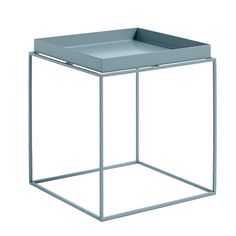 a white square side table with a tray on the top and one section open to reveal a drawer