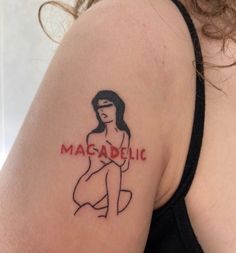 a woman's arm with a tattoo on it that reads masadelic