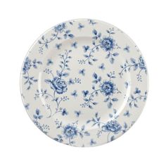 a blue and white plate with flowers on it