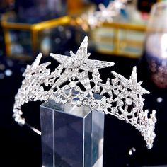 Much like its namesake constellation, this star-studded tiara is shining brightly and can complete the most sophisticated of bridal looks, perfect for a celestial-themed wedding. Intricately faceted baguette crystals work their way across the band capturing the light from every angle with a perfectly translucent appeal. Available in Yellow Gold and Silver finishes. To make your choice select your preferred finish from the dropdown menu. Cast in lightweight alloy and rhodium/gold plated for a fla Quinceanera Crown, Tiara Gold, Wedding Tiara, Star Wedding, Colored Wedding Dresses, Bridal Tiara, Wedding Hair Accessories, Bridal Looks, Gold And Silver