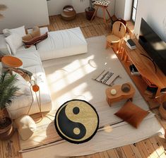 a living room filled with furniture and a flat screen tv sitting on top of a wooden floor