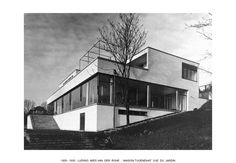 an old black and white photo of a house on a hill with stairs leading up to it