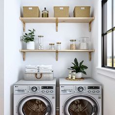 a washer and dryer in a small room with shelves on the wall above them