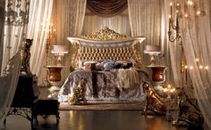 an elaborately decorated bedroom with gold and white decor on the walls, flooring and curtains