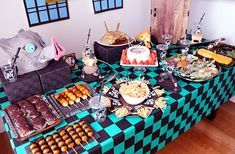 a table topped with lots of food and desserts