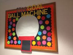 a bulletin board with the word ball machine on it's front and colorful circles around it