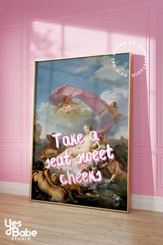 a pink room with a painting on the wall that says take a seat, sweet cheeks