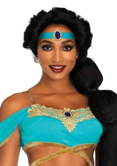 a woman in a blue and gold costume with long black hair wearing an elaborate headpiece