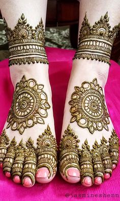 the feet are decorated with henna