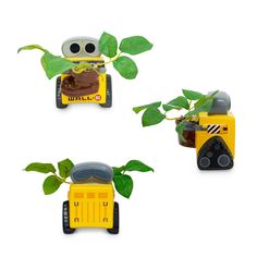 three small toy cars with plants growing out of the front and back, on white background