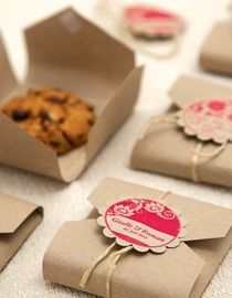 some brown paper bags with cookies in them