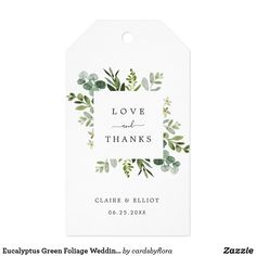 a white tag with green leaves on it and the words love and thanks written in black