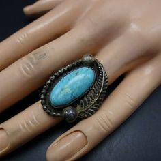 "VINTAGE NAVAJO RING DESCRIPTION: This exceptional old ring will be a treasured addition to your collection of fine vintage Native American jewelry. MEASUREMENTS: Ring face measures 1 1/4\" x 7/8\" Cabochon measures 21mm x 10mm RING SIZE: 5 3/4 WEIGHT: grams SIGNED: no STERLING: unmarked, verified sterling silver" Untreated Southwestern Style Ring Jewelry, Antique Patina Ring, Collectible Patina Ring, Antique Turquoise Ring For Anniversary, Vintage Sterling Silver Turquoise Ring Stamped 925, Vintage Handmade Oval Engraved Ring, Untreated Southwestern Jewelry Collectible, Vintage Handmade Engraved Oval Ring, Handmade Vintage Oval Engraved Ring