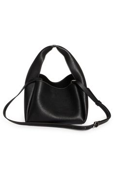 Sculpted from grained leather in a cube silhouette, this bucket bag offers plenty of room for the everyday essentials while retaining a lightweight feel. Carry the versatile look by the folded handle or attach the adjustable strap for shoulder wear. Bridge-clip closure Top carry handle; removable, adjustable shoulder strap Interior wall pocket; card slot Leather Made in Italy Designer Handbags Pocket Card, Leather Bucket Bag, Leather Bucket, Interior Wall, Blazer Outfits, Wall Pockets, Everyday Essentials, Who What Wear, Designer Handbags