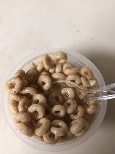 a plastic container filled with cereal on top of a table