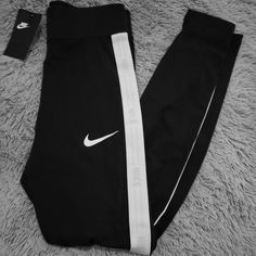 Brand New Size Small. Black With White Side Stripes And Light Pink Logos. Black Stretch Nike Tights, Nike Black Stretch Tights, Fitted Nike Black Tights, Nike Black Fitted Tights, Fitted Black Nike Tights, Nike Running Leggings, Mesh Panel Leggings, Nike Sportswear Women, Nike Pro Leggings